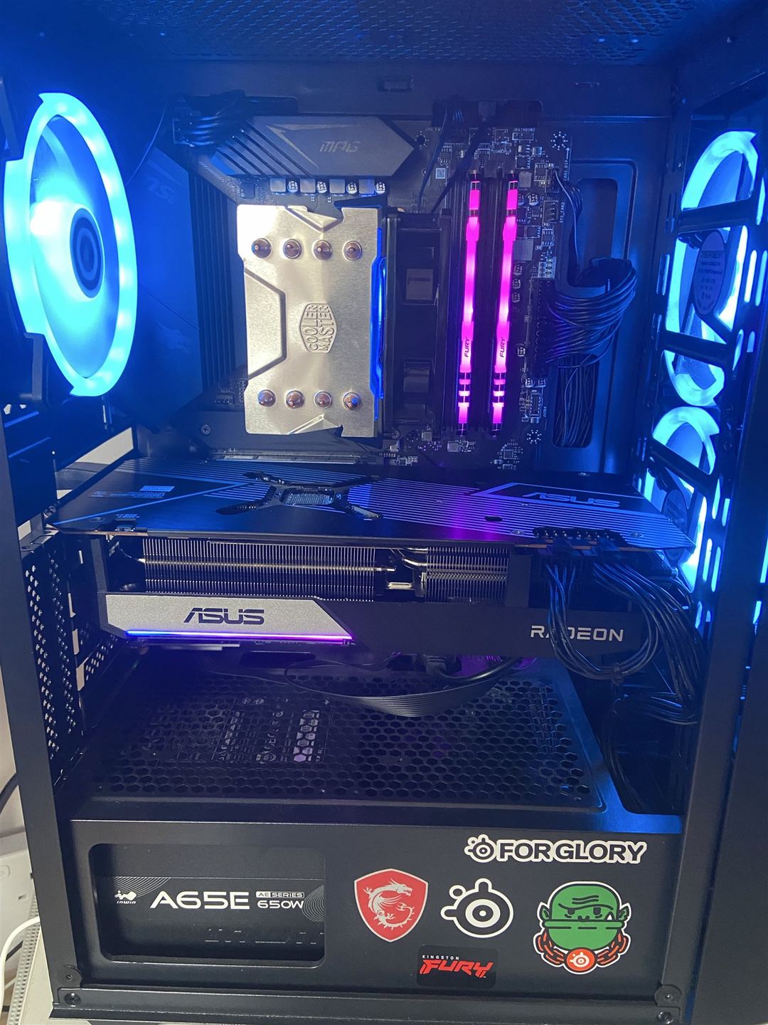 PC interior with blue case fans, RGB memory and an ASUS Radeon graphics card
